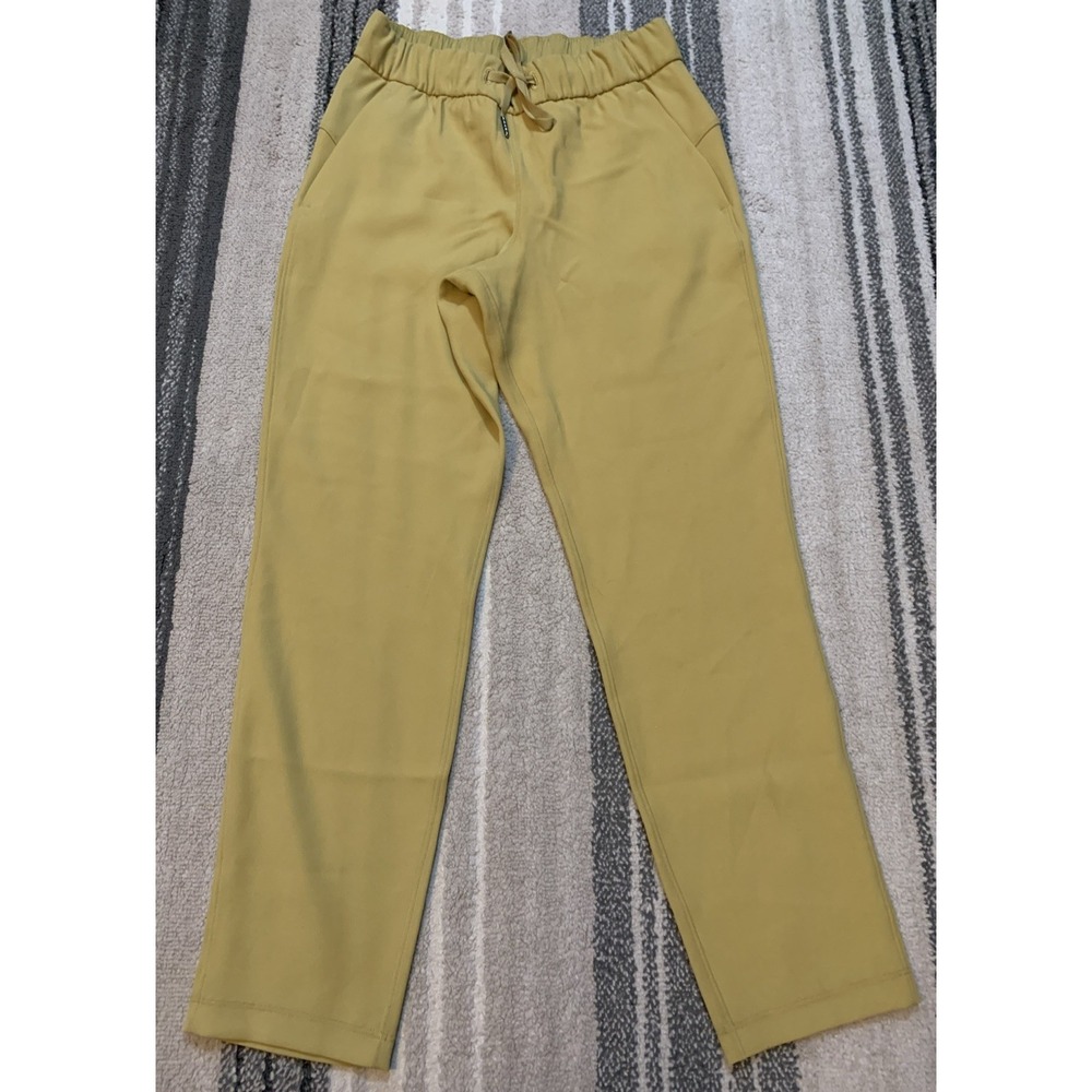 Lululemon On The Fly 7/8 Pants Gold Size 4 Travel Woven Drawstring NWOT‎